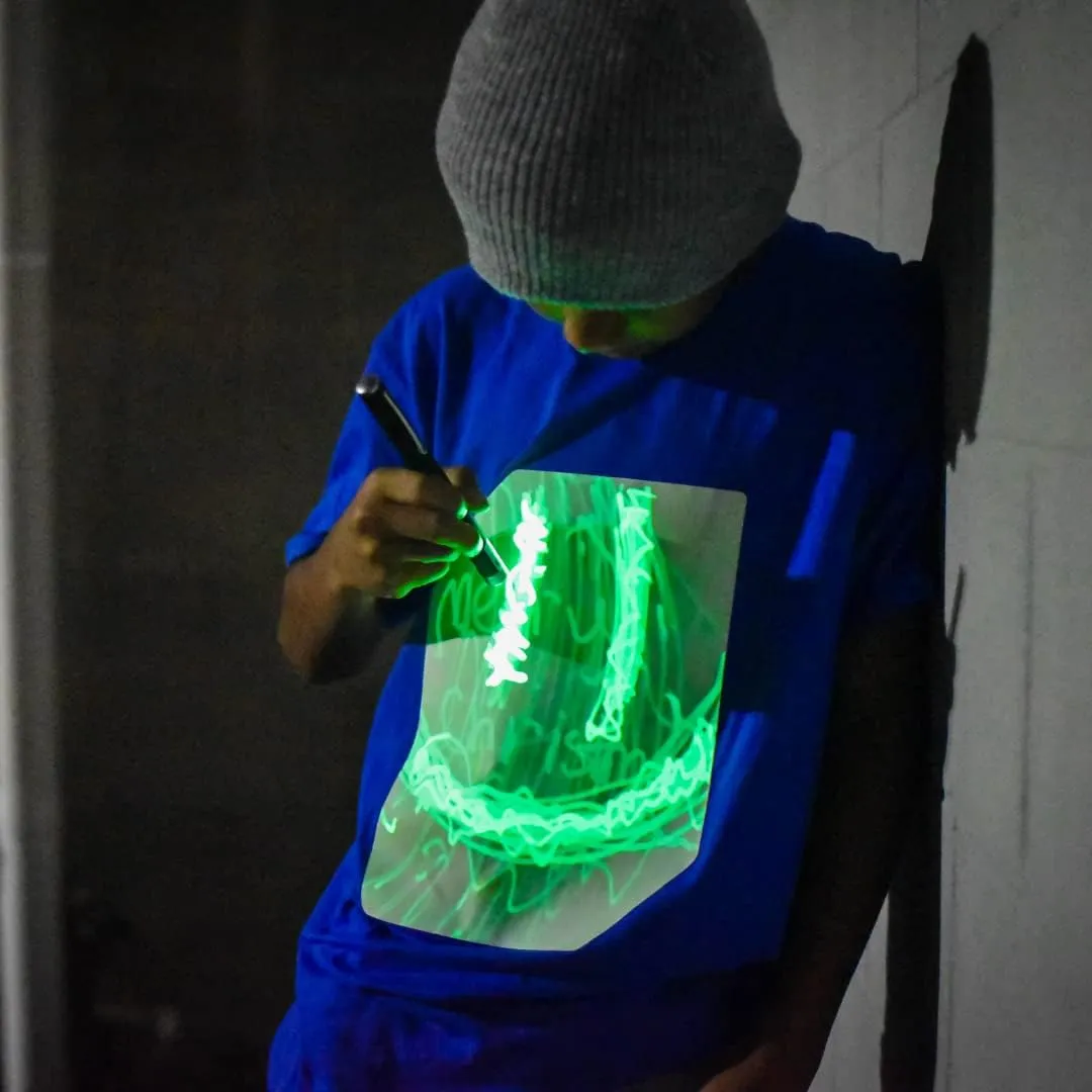 Illuminated Apparel Original Interactive Glow in The Dark T-Shirt - Fun for Birthday Parties & Festivals
